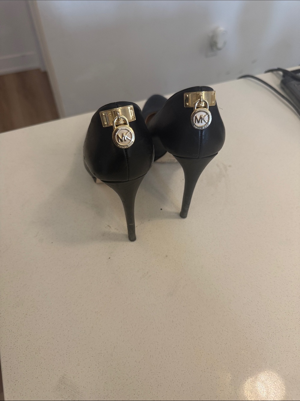 Michael Kors Black Leather Stiletto Heels with Gold MK Charm